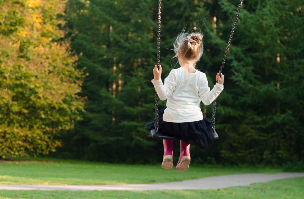 Little girl on swing
