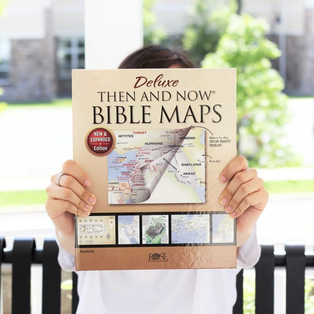 Person holding Rose Deluxe Then and Now Bible Maps (New and Expanded Edition)